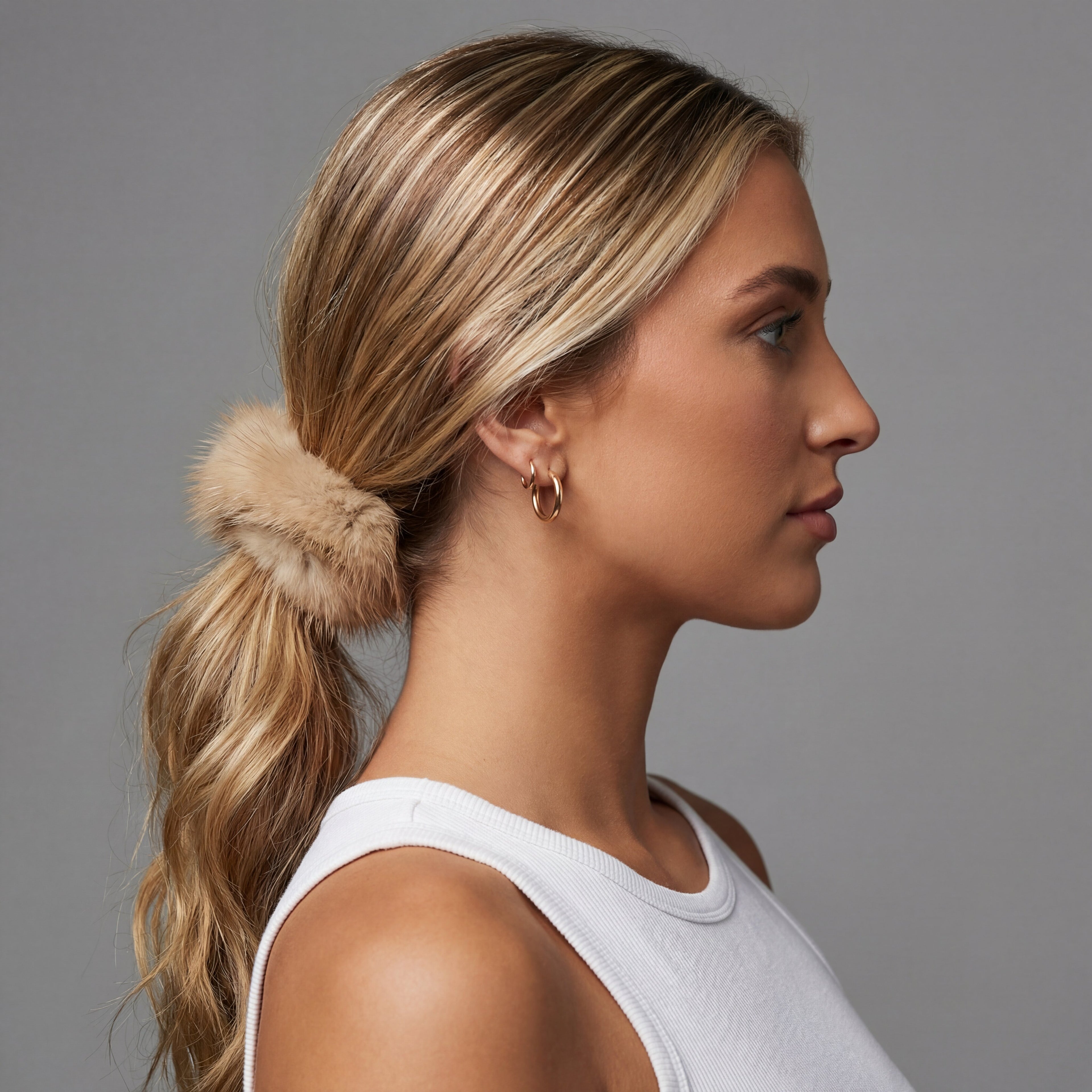 red fox fur scrunchie holding up someones hair